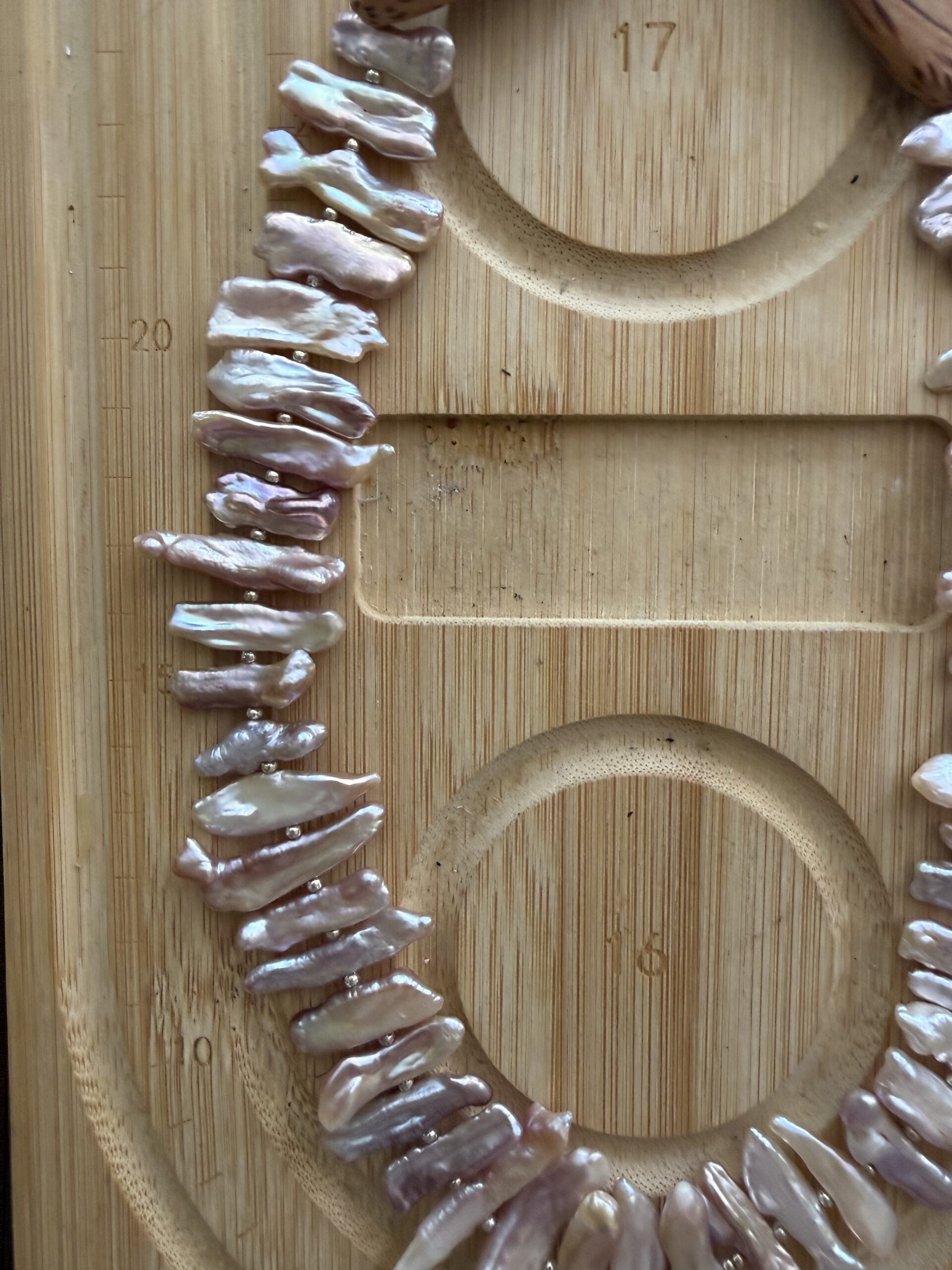 Handcrafted chicken wing wood and baroque pearl necklace featuring unique pearl teeth shapes. A nature-inspired luxury jewelry piece symbolizing beauty and harmony.